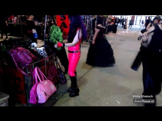 latex girl with pink rubber catsuit, gloves, mask and fashionable boots shopping in agra mall on wgt
